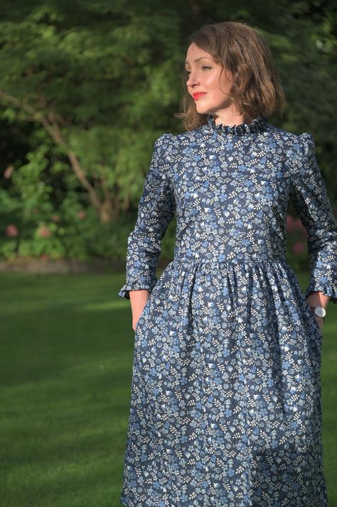 Hand made Liberty of London Tana Lawn Peter Pan Ruffle Collar, Floral print sleeveless dress with 3/4 sleeves with a ruffle cuff Loose fitting dress with bust darts in a beautiful liberty print cotton fabric with Peter Pan collar. This dress is a loose fitting smock shape with a removable belt. 3/4 leeves have a slight puff at the shoulder and a ruffle cuff. I have tied it to the back in these photos to give it a more fitted shape. The skirt has pockets and is 70cm long, lined with plain cotton lawn.  Liberty Tana lawn is a very fine cotton fabric with a silky handle. It is very soft and comfortable to wear. Body Size measurements: SizeBUSTWAIST 833" /84cm26"/66cm 1035"/ 89cm28"/71cm 1237"/94cm30"/76cm 1439"/99cm32"/81cm 1641"/104cm34"/86cm 1843"/109cm36"/91cm 2045"/114cm38"/96cm Every gar Liberty Print Dress, Willow Dress, Cotton Lawn Fabric, London Dress, Fitting Dress, London Print, Loose Fitting Dresses, Floral Outfit, Liberty Print