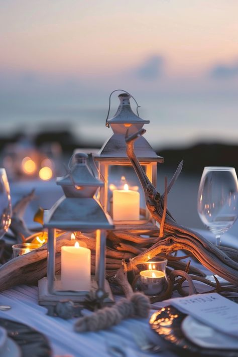 Capture the essence of love with these breathtaking wedding centerpieces. A blend of rustic driftwood and luminous lanterns create an unforgettable seaside ambiance 🌊🕯️. Perfect for brides dreaming of a beach-themed celebration 🏖️✨. #WeddingInspiration #BeachWedding #RomanticDecor #LanternCenterpieces #DriftwoodDecor #WeddingIdeas #Tablescapes #EveningGlow Seashell Bouquet, Driftwood Centerpiece, Nautical Candles, Candle Arrangements, Enchanting Wedding, Lantern Centerpieces, Centerpiece Wedding, Enchanted Wedding, Wedding Lanterns