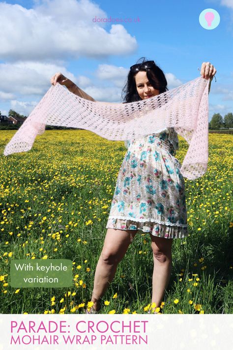 A woman in a meadow holds out a pretty mohair crochet wrap, perfect as a wedding guest accessory, and watches it flutter on the breeze Crochet Mohair Scarf Pattern Free, Crochet Lace Shawl One Size For Winter, Elegant Crochet Wrap Pattern, Winter Crochet Lace Shawl One Size, Bohemian Pink Shawl With Crochet Lace, Pink Crochet Shawl One Size, Mohair Scarf, Crochet Wrap Pattern, Elegant Shawl