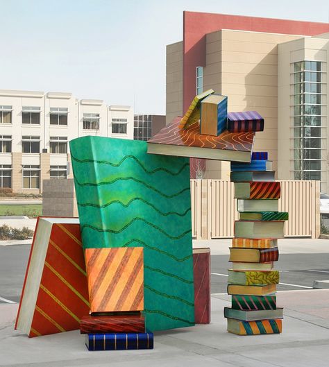 Joseph Bellacera, Catch a Book 2010, 9' x 9' x 7' polychrome steel sculpture, Arthur F. Turner Library, West Sacramento, CA The precariously placed books have literary quotes from authors representing the cultural diversity of the city while the book jackets illustrate local geography and agriculture. aerial landscape painting, aerial abstract, abstract landscape painting, landscape quilt, agricultural landscape painting, rice fields, rice field paintings Book Sculptures, Bookish Art, West Sacramento, Handwritten Text, Library Art, Book Sculpture, Sacramento California, Cool Books, Book Storage