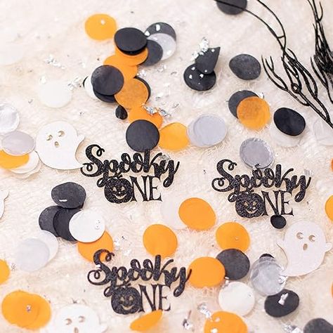 The Halloween-themed first birthday is a wonderful addition to your table decorations for a girl or boy's baby shower or little boo'sgirl's birthday. This charming spooky one confetti is exquisitely detailed. This tissue paper confetti with black glitter or orang glitter spooky one confetti makes a beautiful table scatter to sprinkle around the cake, desert table, gift table, food buffet, or Halloween 1st birthday. Halloween Birthday Decorations, Spooky One Birthday, Cake Desert, Halloween Confetti, Party Decorations Table, Halloween 1st Birthdays, Spooky One, 1st Birthday Party Decorations, Paper Confetti