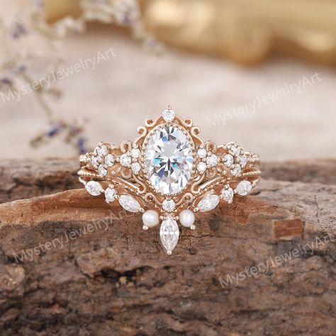 Vintage Moissanite Engagement Ring Set Rose Gold Ring Set Pearl Ring Bridal Set Moissanite Cluster Ring Diamond Ring Promise Rings for Women Only 1pcs Engagement Ring: https://www.etsy.com/listing/1615421111 Only 1PCS Wedding Band: https://www.etsy.com/listing/1586494152  💎RING DETAILS  Material: 10K/14K/18K yellow gold, white gold, and rose gold are available. (Other metals and stones are also available, please feel free to contact me directly for sterling silver or platinum.) ------ ENGAGEMENT RING ------ ◈ Center Stone: Moissanite ◈ Shape: Oval Shaped ◈ Size: 5x7mm ◈ Accent Stone: Moissanite or Diamond ◈ Shape: Round cut ◈ Weight: Moissanite About 0.14ct ◈ Bandwidth - 1.5mm ------ WEDDING BAND ------ ◈ Stones: Freshwater pearl & Moissanite or Diamond ◈ Shape: Round & Marquise cut ◈ Wei Sagittarius Engagement Ring, Unique Wedding Rings Engagement Gold, Antique Engagement Rings Vintage 1920s, Vintage Wedding Rings 1920s, Floral Wedding Rings, Boho Wedding Rings, Engagement Rings Etsy, Vintage Marquise Engagement Ring, Western Wedding Rings