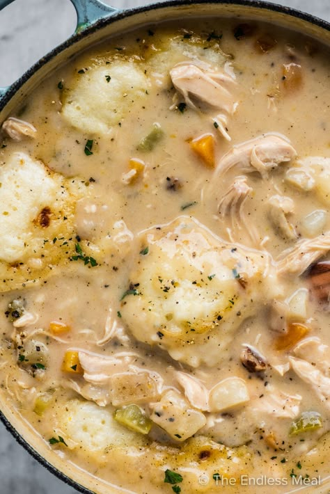 This creamy chicken stew with dumplings is comfort food at its best. The deliciously creamy chicken and vegetable stew is topped with easy homemade dumplings that are light and fluffy. You don't want to miss this easy one-pot dinner! #theendlessmeal #stew #chickenstew #chicken #creamy #creamychickenstew #chickenstewwithdumplings #dumplings Cast Iron Stew Recipes, Easy Homemade Dumplings, Chicken Stew With Dumplings, Rainy Day Dinner Ideas, Chicken And Vegetable Stew, Chicken Stew And Dumplings, Stew With Dumplings, Creamy Chicken Stew, Chicken Vegetable Stew