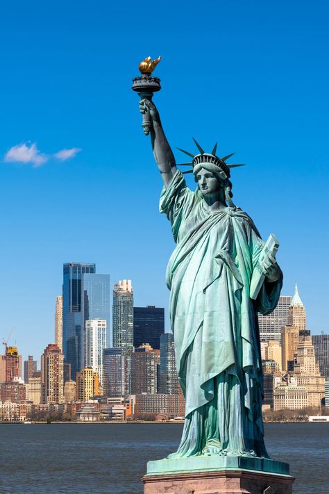 🗽✨ Step into the vibrant heart of New York City on this iconic tour!   Witness the classic landmarks that define the city's spirit - like the Statue of Liberty and Times Square. Then, feel the rhythm of Broadway's hit musical Hamilton and savour every moment of "The Big Apple"🍎  #NewYork #City #BigApple #Broadway #TimeSquare #StatueOfLiberty #NYC #Explore #Destination #Travel New York City Statue Of Liberty, Timesquare New York City, Statue Of Liberty Aesthetic, Newyork Timesquare, Hoodie Website, Famous Statues, Time Square New York, World Monuments, Usa Landmarks