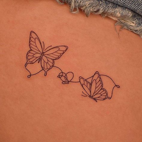 Fine line style butterfly couple tattoo located on the Butterfly Vine Tattoo Arm, Butterfly Couple Tattoo, Cute Small Tattoo Ideas, Butterfly Couple, Sister Tats, Butterfly With Flowers Tattoo, Butterfly Tattoo Ideas, Small Matching Tattoos, Small Dragon Tattoos