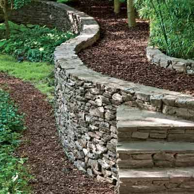 a mortared-stone retaining wall. There's only one place on our property that would be applicable to this and it is near the street, oh boy what eye candy for a gardener like me. Diy Retaining Wall, Rock Retaining Wall, Building A Retaining Wall, Garden Pathways, Stone Retaining Wall, Building A Fence, Walled Garden, Garden Rooms, Retaining Walls