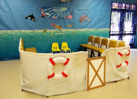 VBS Operation Overboard at Village UMC. Use sheets to create a boat. The life preservers were ordered from Oriental Trading and come 4 to a pack and are lightweight. Make a door for the boat out of foam insulation board. A ful place for children to sit and hear a Bible story. Deep Sea Discovery Vbs, Submerged Vbs, Ocean Vbs, Registration Table, Ocean Commotion, Application Ideas, Foam Insulation Board, Classroom Idea, Make A Door