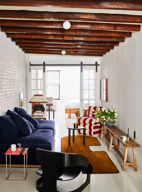 Making a Big Impact on a Small Budget - The New York Times Will Cooper, a partner and the chief creative officer at the New York design firm ASH NYC, painted the wood floor and brick wall in his East Village apartment. “It made a huge difference and changed the whole atmosphere,” he said. Painted Brick Walls, Wall Brick, Brick Interior, Trendy Apartment, New York Apartment, White Brick, Nyc Apartment, Interior Design Firms, Architectural Digest