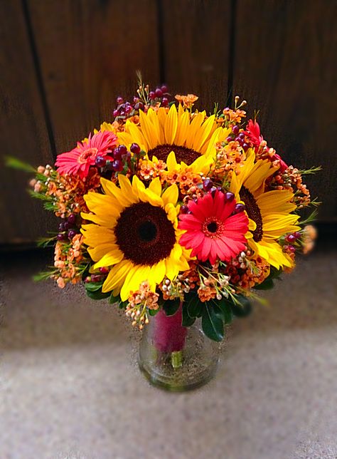 Fall bridal bouquet with sunflowers, gerber daisies, wax flower and hypericum berries Flower Arrangements With Gerber Daisies, Sunflower And Gerber Daisy Bouquet, Gerber Daisy Bouquet Floral Arrangements, Gerber Daisy Centerpiece, Sunflower And Daisy Bouquet, Gerber Daisy Bouquet, Gerber Daisy Wedding, Daisy Bouquet Wedding, Daisy Centerpieces