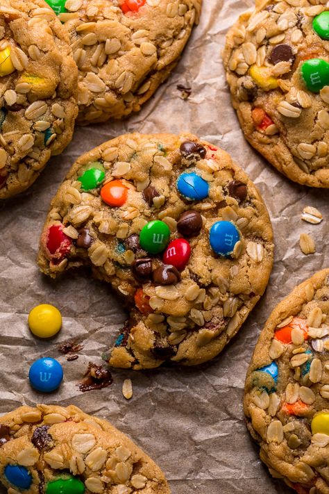 Monster cookies on a baking sheet with parchment paper. Peanut Butter Monster Cookies, Baker By Nature, Chocolate Chunk Cookies, Butter Pecan, Creamy Peanut Butter, Monster Cookies, Chocolate Chips, Salted Caramel, Chip Cookies