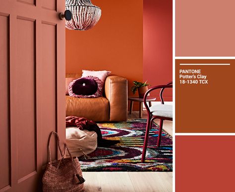 A living room in varying shades of orange, brown and red. Copper Paint Colors, Burnt Orange Bedroom, Terracotta Living Room, Burnt Orange Living Room, Brown Accent Wall, Orange Paint Colors, Autumn Room, Orange Home, Orange Home Decor