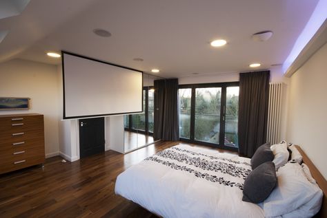 loft conversions bedroom with french doors and a cinema screen built into the ceiling Loft Conversion Design, Projector In Bedroom, Loft Bedrooms, Cinema Screen, Loft Conversion Bedroom, Bedroom Ceilings, Loft Extension, Interior Paint Colors For Living Room, French Doors Bedroom