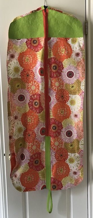 Travel in style - yours - with an easy custom garment bag you make yourself from durable Kraft-tex and your own beautiful fabric! How to Make a Garment Bag | Create Whimsy @ctpublishing #kraft-tex #krafttex #sewing #sewingaccessories #handmade #homesewing #sewingforme #makersgonnamake #creativehappylife #createwhimsy Garment Bag Diy, Dress Holder, Garmet Bag, Sewing Case, Costume Bags, Winter Projects, Cute Sewing Projects, Jewelry Roll, Bag Diy