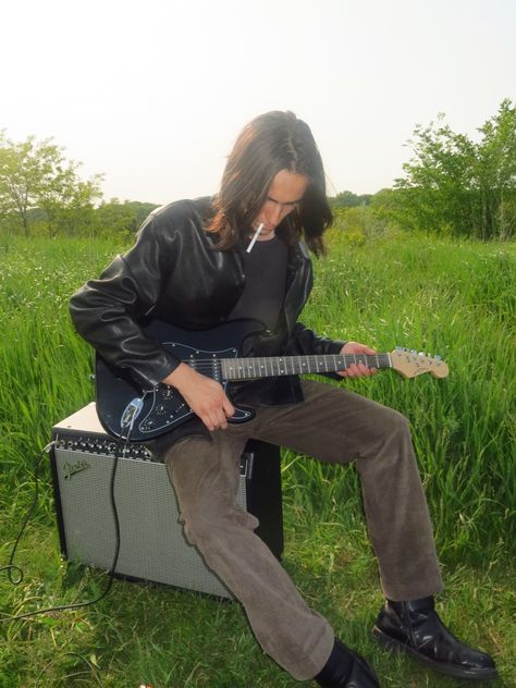 Guitar Leaning Against Wall, Person Playing Electric Guitar Reference, Photoshoot With Electric Guitar, Playing Guitar Pose Reference Sitting, Person Holding Electric Guitar, Male Guitarist Pose Reference, Sitting With Guitar Pose, Acoustic Guitar Pose Reference, Gutair Pose Reference