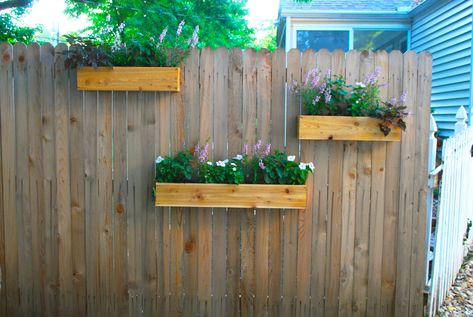 Hanging Plants On Fence, Tractor Planter, Fence Hanging Planters, Diy Cedar Planter Box, Wooden Tractor, Hanging Planter Boxes, Diy Wooden Planters, Backyard Planters, Outdoor Planter Boxes