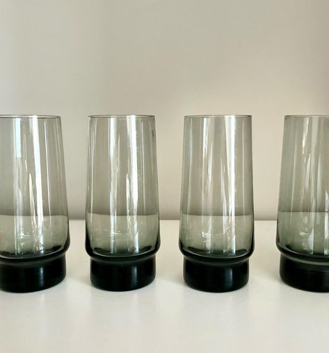 1970s barware. Set of 4 mid century smoked glass tumblers. high. Vgc. £38 PM if interested #vintageglass #sustainablegiftware #prettyglass #20thCentury#vintage #midcenturymodern#midcentury #glassware #mcm #70’s #libbey #tumblers #smokedglass #vintagebarware Glass Tumblers, Vintage Barware, Glass Tumbler, Midcentury Modern, Barware, 1970s, Accessory Gift, Pet Supplies, Tumbler