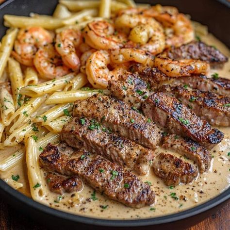 Jamie Oliver Recipes | Cajun Shrimp and Steak Alfredo Pasta | Facebook Shrimp And Steak Alfredo Pasta, Steak Alfredo Pasta, Steak Alfredo, Steak Shrimp, Pasta Alfredo, Steak And Shrimp, Pasta Ingredients, Cajun Shrimp, Alfredo Pasta