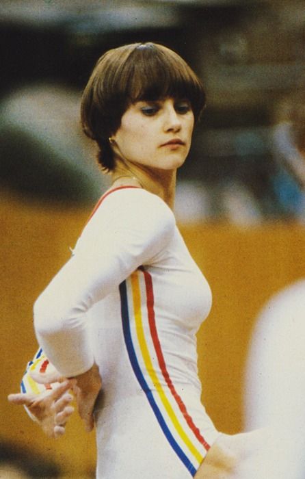 Nadia Comaneci, athlete who won gold with 10/10 score in each round in 1974 Olympic Nadia Comaneci Perfect 10, Gymnastics Uniforms, Berlin Style, Nadia Comaneci, Acrobatic Gymnastics, Sport Bikinis, Gymnastics Pictures, Olympic Gymnastics, European Girls