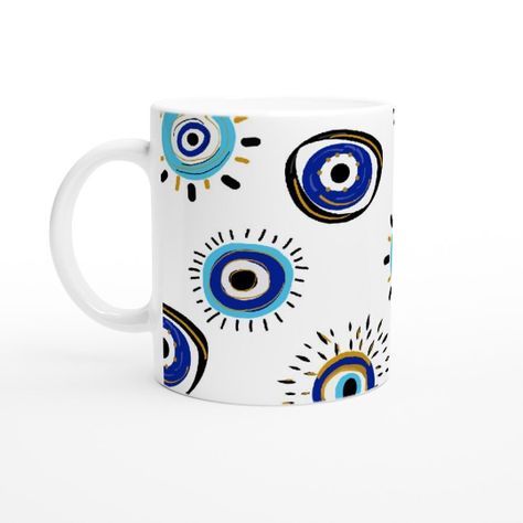 The Evil Eye mug is a unique and stylish addition to any coffee or tea drinker's collection. Its eye-catching design featuring the traditional "evil eye" symbol is not only visually appealing but also believed to offer protection. Evil Eye Mugs, Evil Eye Mug, Clay Cafe, Evil Eye Symbol, Diy Pottery Painting, Eye Symbol, Pottery Painting Designs, Painted Mugs, Eye Painting