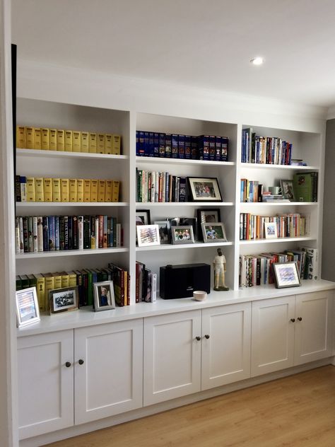 Wall to wall shelving with cupboard storage to base.  Useful shelving for books, photos and display purposes. Home Office Shelves, Built In Shelves Living Room, Office Bookshelves, Living Room Built Ins, Office Shelving, Office Shelf, Bookcase Wall, Home Library Design, Bookshelf Design