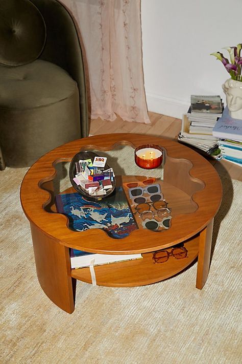 Bring cottage-ready charm to your living space with this eye-catching coffee table. This coffee table with a storage shelf below the table showcases a curving silhouette with a wavy, tempered glass tabletop. Available exclusively at Urban Outfitters. Features Stacie Coffee Table from UO Home’s Stacie furniture collection Coffee table with storage is perfect for your smaller spaces Tempered glass tabletop in a wavy, flower-like shape One fixed shelf to display your coffee table books, candles & other trinkets Removable legs so you can easily move your coffee table throughout your space Assembly required UO exclusive Content + Care Assembly required - assembly instructions and hardware are included Acorn/Natural: Solid rubberwood, MDF, rubberwood veneer, bentwood, 5mm tempered glass Painted: Coffee Table For Small Living Room, Coffee Table Urban Outfitters, Funky Coffee Tables, Eclectic Coffee Tables, Tall Coffee Table, Coffee Tables Modern, Uo Home, Unique Coffee Table, Unique Tables