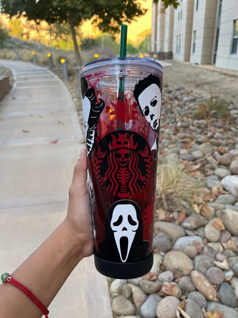 Halloween Horror Blood Drip Starbucks Tumbler  Halloween Fake Blood Starbucks Blood  Micheal Myers, Chucky, Scream, Ghost Face, IT, Jason Vorhees 24 oz Starbucks cold cup, plastic reusable straw, and plastic lid Designs are permanent vinyl decals. Cups are NOT sealed. Care Instructions: hand wash only, not microwave safe, not dishwasher safe (care card included) Any Questions Message me on here or on my business instagram @customcups_byelizabeth Horror Snowglobe Tumbler, Halloween Cups Designs, Horror Gift Ideas, Halloween Tumbler Cups, Ghost Face Tumbler, Horror Merchandise, Halloween Starbucks Cup, Drip Tumbler, Halloween Tumblers