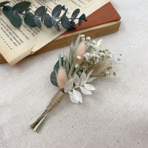 Blush pink flower Boutonniere, Eucalyptus Boutonniere, Dried flower boutonniere, Wedding Greenery buttonhole, Grooms flower boutonniere →A beautiful natural boutonniere that would be perfect for a natural rustic wedding, or a keepsake that adds the perfect touch of greens and blush colors to a bohemian summer wedding. Our handmade rustic dried flower buttonholes are a great alternative to add a bohemian flair to your wedding. → As your crowns are handmade, please expect some changes in your crowns, the placement and appearance will be slightly different. All my pieces are made with love and care. It is an original handmade product. →Custom orders are welcomed, if you want to buy more or different shades, welcome to contact me, Thank you for visiting my shop. Sage Green And Blush Wedding Boutonniere, Blush Pink And Sage Green Boutonniere, Greenery Buttonhole, Natural Boutonniere, Grooms Flower, Boutonniere Eucalyptus, Natural Rustic Wedding, Eucalyptus Boutonniere, Dried Flower Boutonniere