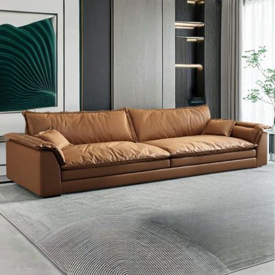 Introducing our Sofa - the epitome of modern design and utmost comfort. Available in various sizes, it's the perfect addition to your living space. Crafted from 100% Polyester, it's lightweight, durable, and wrinkle-resistant. Enjoy luxurious softness with its unique foam and down filling, ideal for long hours of relaxation. Sturdy pine wood frame ensures durability. Easy assembly, instant luxury. Embrace comfort and style with our Sofa. Natural variation: The product is made of natural material Leather Couch Sunroom, Long Couches Living Room, Leather Sofa And Accent Chairs, Vintage Couch Living Room, Zen Interior Design Living Room, Mid Century Modern Leather Couch, Comfortable Modern Furniture, Comfy Sofa Living Rooms, Durable Couch