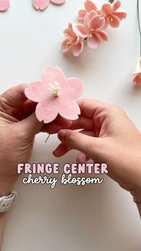 A felt cherry blossom using felt fringe as the center. I hold the flower for several seconds so the glue has time to harden before letting go. #feltflower #cherryblossom #feltflowertutorial #feltflowercenter | Resa Curbo Creative | Resa Curbo Creative · Original audio Felt Cherry Blossom Diy, Red Felt Flowers, Felt Wildflowers Diy, Felt Sheet Flowers, Felt Flowers Patterns Templates, Felt Flower Patterns Free, Felt Flower Templates Printable Free, Felt Cherry Blossom, Rehearsal Bouquet