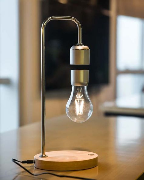 This remarkable lamp not only illuminates your space with a gentle, warm glow but also astonishes with its unique levitating light bulb, held aloft by the power of magnets. The magic extends beyond mere levitation. Hidden within the lamp’s base is a powerful wireless phone charger, discreetly blending technology with function. 🔍 Product: Levitating Lamp (Wireless Charger) 👆 Tap the link in bio for more lamps! . . . . . . . . . . . . . . . . . . #decorcrushing #interior4u #interior4inspo #sa... Levitating Lamp, Wireless Light Bulb, Night Stand Lamp, Cool Office Desk, Stylish Bedroom Decor, Floating Table, Luminaire Original, Apartments Decorating, Wireless Lights