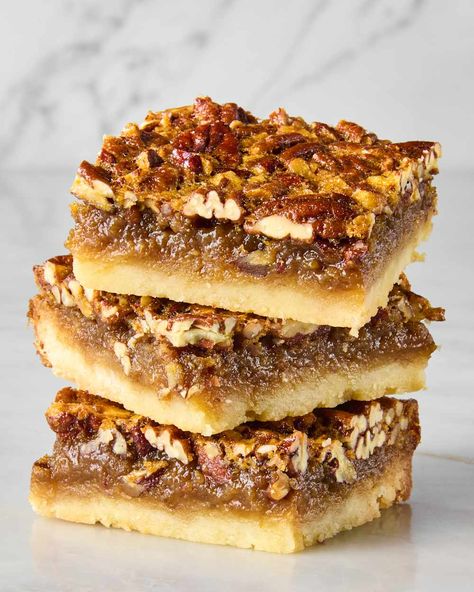 head on shot of three pecan pie bars stacked on each other Weird Thanksgiving, Easy Pecan Pie Bars, Thanksgiving Dessert Ideas, Pecan Bars Recipe, Pecan Pie Bars Easy, Thanksgiving Dessert Recipes, Easy Pecan Pie, Pecan Pie Bars Recipe, Pecan Pie Muffins