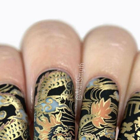 Marilynn on Instagram: "Hi! I’m joining a group of nail friends in wishing a happy birthday to the incredibly talented @fificrossnails 🥳  We’re celebrating Fiona today with a theme of black and gold patterns. I was inspired by a gorgeous antique Japanese teacup set I have with a black and gold dragon print… these were fun to stamp! I added in a couple details on the dragon by hand, too. For the clouds I used a sheer white polish for a smokey effect.  Hope you have a super special day, Fiona! Many thanks to our lovely hosts, and the rest of the gorgeous manis can be seen under #FionaIsFiftyandFabulous 🎉  .🐉Products used🐉 Orly “Liquid Vinyl” Cuticula “Coconut Milk Sorbet” What’s Up Nails stamping polish “Go for Gild” Maniology plate M460 What’s Up Nails Magnified Clear Stamper OPI Matte Dragon Print Nails, Teacup Nails, Black And Gold Dragon, Japanese Teacup, Dragon Nails, Up Nails, Teacup Set, White Polish, Gold Dragon