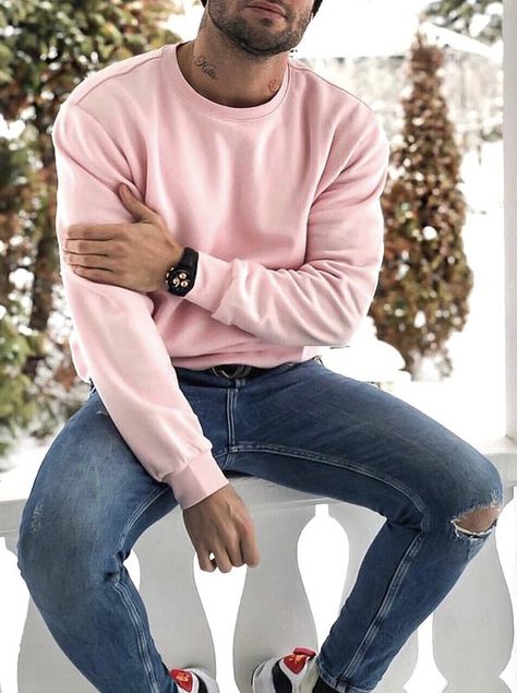 With blue ripped jeans | #menssweater #winteroutfits #mensclothing #menswear Crewneck Outfit Men, Blue Sweatshirt Outfit, Pink Sweatshirt Outfit, Sweatshirt Outfit Men, Blue Jeans Outfit Men, Light Blue Jeans Outfit, Pink Sweater Outfit, Pink Shirt Men, Winter Outfits For Men