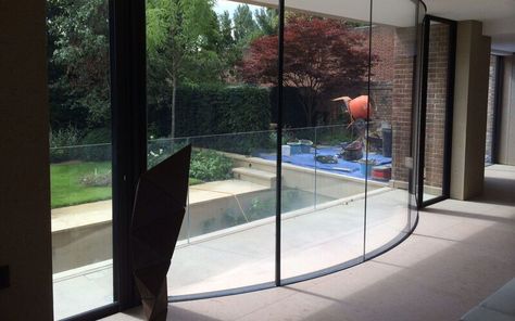 Curved glass windows and doors for luxurious finish | Projects | IQ Glass Frameless Glass Balustrade, Curved Wall, Steel Windows, Glass Balustrade, Curved Walls, Glass Floor, Curved Glass, Floor To Ceiling Windows, Ceiling Windows