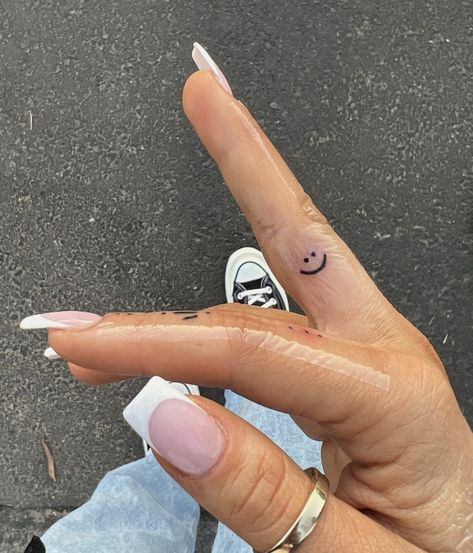 Smile Face Tattoo, Side Finger Tattoos, Inner Finger Tattoo, Smiley Face Tattoo, Middle Finger Tattoos, Delicate Tattoos For Women, Luck Tattoo, Tattoo Catalog, Smile Tattoo