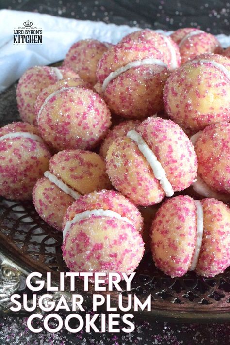 These beautiful, shimmering, Glittery Sugar Plum Cookies are the epitome of priceless luxury on a dollar store budget.The cookies are baked with a sparkling, sugary coating and sandwiched together with an easy, sweet frosting. One bite and you'll certainly have visions of these sugar plums dancing in your head on Christmas Eve night! #sugarplums #christmas #baking #cookies #glitter Plum Cookies, Sugar Plum Recipes, Old Fashioned Molasses Cookies, Orange Bundt Cake, Plum Recipes, Sugar Plums, Berry Muffins, Molasses Cookies, Sugar Plum Fairy