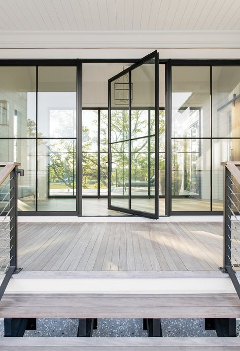 One family’s Fresh Start with custom-designed digs on Captain’s Island | Charleston SC | Charleston Magazine Master Balcony, Modern Tree House, Balcony Door, Pivot Door, House Decor Modern, Coastal Modern, Pivot Doors, Casement Windows, Iron Doors