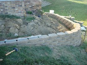 Dishing Up Design: DIY Retaining Wall & Landscaping Two Tier Front Yard Landscaping, Sloped Pathway, Corner Retaining Wall, Front Yard Retaining Wall Ideas, Retaining Wall Landscaping, Brick Retaining Wall, Brick Wall Gardens, Diy Retaining Wall, Backyard Patio Ideas