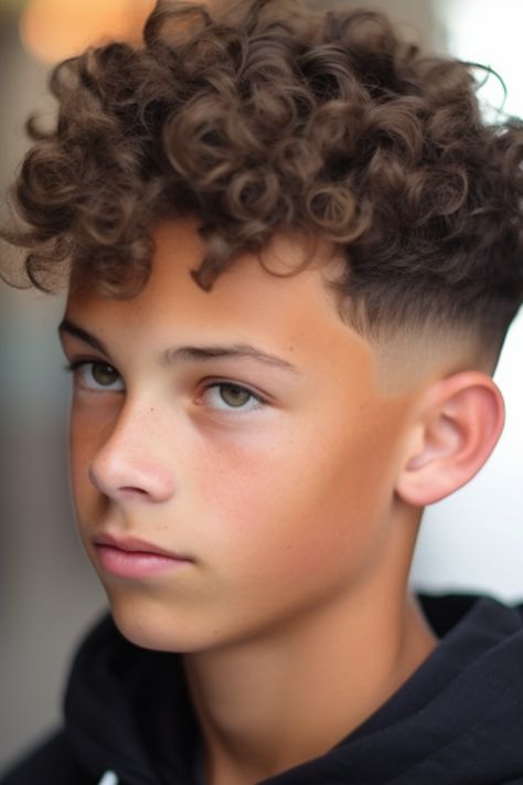 For boys with curly hair, a taper fade paired with twisted curls offers a stylish appearance. The taper fade emphasizes the curls on top, creating a contrast. Click here to check out more best teenage boy haircuts this year. Boys Perms With Fade, Perm On Boys Hair, Boys With Permed Hair, Boys Perms Hair, Hair Cuts For Boys Curly, Curly Hair Fade Boys, Fades With Curly Hair, Curly Fade Boys, Tapered Fade Boys