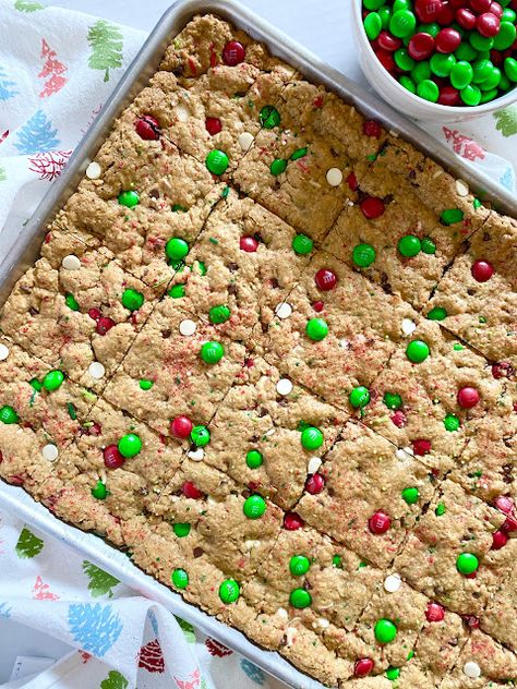 Christmas Monster Cookie Bars Monster Bars, M M Cookie Bars, Monster Bar, Monster Cookie Bars, Christmas Cookie Bars, Oatmeal Cookie Bars, Pan Cookies, Holiday Bar, Holiday Sprinkles