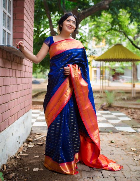 This Kanjivaram silk saree with Veldhari work is the epitome of classical beauty and timeless tradition. The rich blue body is offset by a vibrant red border embellished with elephant and horse patterns. Simple gold studs and a center parted braid adorned with flowers completed Ramya Subramaniam's look! Saree: Tulsi Silks  Make-up and hair-do: Page3salon Simple Gold Studs, Tulsi Silks, Blue Silk Saree, Kanjivaram Sarees Silk, Saree Wearing, Saree Wearing Styles, Saree Draping Styles, Kota Silk Saree, Pattu Saree Blouse Designs