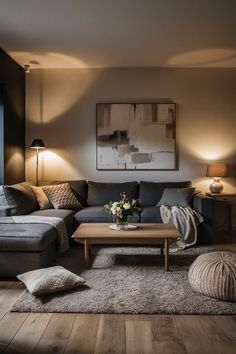 Dark Great Couch Living Room, Cozy Apartment Aesthetic Living Room Dark, Dark Couch Light Room, Living Room With Charcoal Sofa, Dark Academia Apartment Aesthetic Living Room, Apartment Black Decor, Styling A Dark Grey Couch, First Home Living Room Ideas, Cozy Living Room With Grey Couch