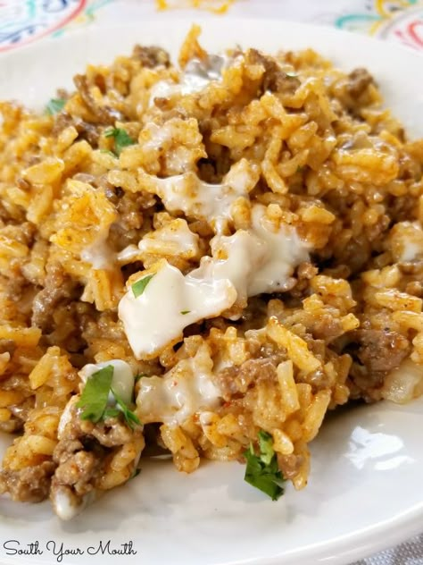 Taco Rice Skillet Dinner with Queso! A one-pan recipe made with ground beef, taco seasoning and Mexican style rice drenched in an easy queso cheese sauce. Queso Cheese Sauce, Taco Rice Skillet, Mexican Style Rice, Easy Queso, Beef Taco Seasoning, Ground Beef Taco Seasoning, Ground Beef Taco, Taco Rice, Skillet Dinner Recipes