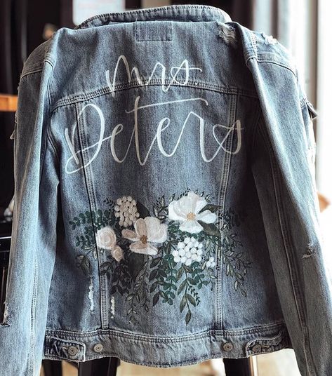 KRorerDecor Custom Bridal Jackets make the perfect edgy statement to compliment your wedding dress on your big day. Show off your unique style and personality with this hand painted jacket that will quickly become a keepsake you’ll love to reminisce about! Get all the info at www.krorerdecor.com Bespoke Denim, Jacket Hand Painted, Lets Get Married, Hand Painted Denim, Personalized Jacket, Hand Painted Denim Jacket, Fitted Denim Jacket, Painted Denim Jacket, Painted Jacket