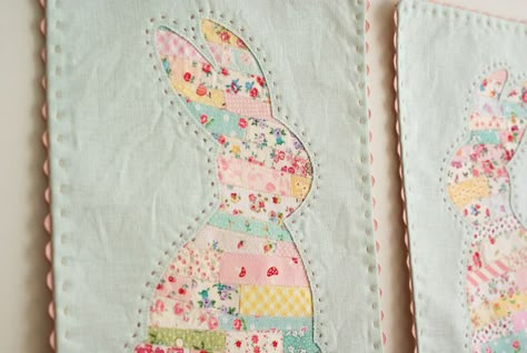 Great idea= tiny scraps striped pieced and laid beneath a design for reverse applique  love the name of original site :) Rabbit Quilts Pattern, Easter Wall Hanging Quilted, Sewing Wall Hanging, Easter Bunting Ideas, Easter Pillows Diy, Rabbit Applique Pattern Free, Patchwork Wall Hanging, Bunny Pillow Pattern, Rabbit Quilt Block