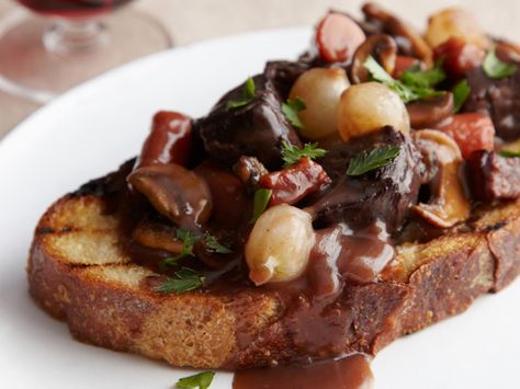 Ina Garten's Beef Bourguignon - In this foolproof take on the classic, often complex French stew, beef is simmered in red wine in the oven — not on the stove — at a constant temperature for perfect results every time. http://www.foodnetwork.com/recipes/ina-garten/beef-bourguignon-recipe.html Beef Bourguignon Recipe, Ina Garten Recipes, Munnar, Beef Dishes, Food Network, Main Dish, Soups And Stews, Food Styling, Taste Buds