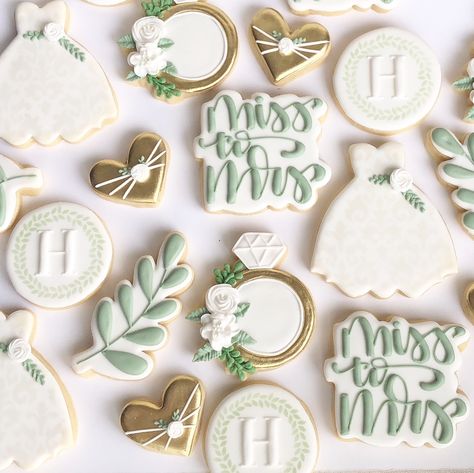 Sage, gold and white/ivory bridal shower party cookies ideas with floral gold solitaire ring and sage leaves and monogram with greenery, miss to mrs Party Cookies Ideas, Piping Cookies, Bridal Shower Sugar Cookies, Wedding Dress Cookies, Wedding Shower Cookies, Green Bridal Showers, Engagement Cookies, Bridal Cookies, Party Cookies