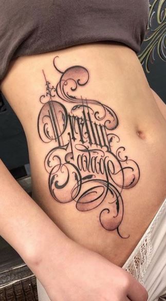 Unique Lettering Tattoo, Large Script Tattoo, Big Lettering Tattoo, Script Lettering Tattoo Calligraphy, Chicana Tattoos For Women Lettering, Locals Only Tattoo, Different Tattoo Lettering Styles, Lettering Tattoos For Women, Names On Ribs Tattoo