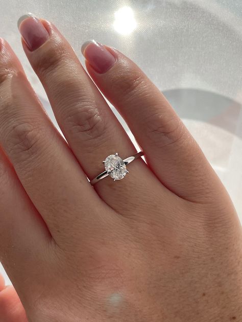 New In from our 2022 collection!  💎This simplistic but absolutely beautiful engagement ring features 1.5CT oval cut  white D color Moissanite stone on a minimal 1.8mm sterling silver band. Truly elegant and timeless design.  💎Made of high quality sterling silver and plated with rhodium it will not rust or turn your finger green. Center stone size - 6mm*8mm(1.5Ct) Color Grade - D Clarity Grade- VVS1 Cut: Excellent  Material:  Fine Sterling Silver 925 Plating: Rhodium    💎Comes with authenticit Engagement Rings Silver Dainty, Oval Engagement Ring With, Silver Oval Moissanite Engagement Ring, Simple Silver Oval Engagement Ring, Oval Silver Band Engagement Ring, Simple Wedding Rings Silver Oval, Timeless Engagement Ring White Gold, All Silver Engagement Ring, Engagement Silver Ring