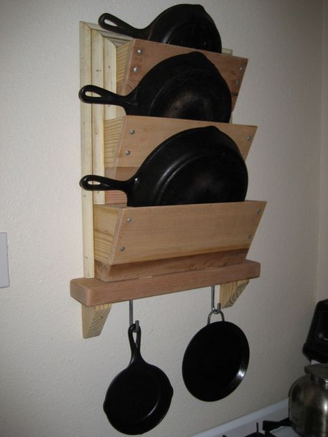 I finally got tired of having to shuffle our collection of cast-iron skillets from the oven to the stovetop every time we wanted to bake something. The kitchen in our apartment doesn't really have ... Bake Something, Wooden Plane, Iron Storage, Wooden Toys Plans, Iron Skillets, Pot Rack, Cast Iron Cookware, Iron Skillet, Cast Iron Skillet